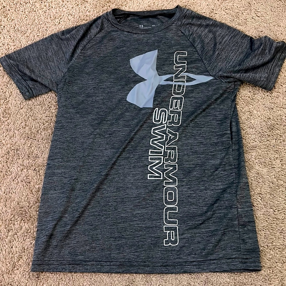 Dark grey under armor dri-fit t-shirt. Youth XL, fits like a Women’s medium.